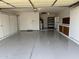 Well-organized garage with epoxy flooring, storage cabinets, and ample workspace at 11444 S 51St St, Phoenix, AZ 85044