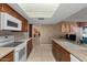 Well lit eat-in kitchen with lots of counter space, white appliances, and wood cabinets at 11444 S 51St St, Phoenix, AZ 85044
