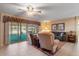 Inviting living area with comfortable seating, ceiling fan, and backyard access at 11444 S 51St St, Phoenix, AZ 85044