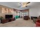 Cozy living room featuring a fireplace, comfortable seating, and access to the sunroom at 11444 S 51St St, Phoenix, AZ 85044
