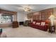 Spacious living room with large sofas, fireplace, and natural light at 11444 S 51St St, Phoenix, AZ 85044