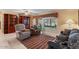 Comfortable living room featuring built-in shelving and a bright sunroom view at 11444 S 51St St, Phoenix, AZ 85044