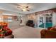 Open-concept living room with kitchen view, fireplace, and access to sunroom at 11444 S 51St St, Phoenix, AZ 85044