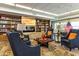 Inviting lobby featuring comfortable seating, a cozy fireplace, and beautiful built-in bookshelves, creating a relaxing atmosphere at 11444 S 51St St, Phoenix, AZ 85044