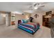 Open-concept main bedroom with attached bathroom, built in storage, and a neutral color scheme at 11444 S 51St St, Phoenix, AZ 85044
