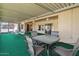 A covered patio has an outdoor dining area with views of the landscape at 11444 S 51St St, Phoenix, AZ 85044