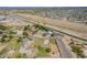Expansive aerial view of a desert community featuring diverse home styles and a serene canal at 15202 N 71St Dr, Peoria, AZ 85381