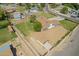 Aerial view of a single-Gathering home with a building, outbuildings and a spacious well-maintained yard at 15202 N 71St Dr, Peoria, AZ 85381