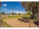 Spacious backyard with grass and a fenced enclosure, offering a great space for outdoor activities at 15202 N 71St Dr, Peoria, AZ 85381