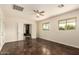 Large bedroom with ceiling fan, two windows and attached room at 15202 N 71St Dr, Peoria, AZ 85381