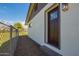 Side exterior view of house showing new door and landscaping at 15202 N 71St Dr, Peoria, AZ 85381