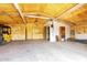 Interior of a garage with insulation, shelving, and lighting offering practical storage and workspace solutions at 15202 N 71St Dr, Peoria, AZ 85381