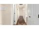 Long hallway with tile floors, white walls, and multiple doorways at 15202 N 71St Dr, Peoria, AZ 85381