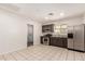 Kitchen with stainless steel appliances and an exterior door at 15202 N 71St Dr, Peoria, AZ 85381