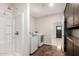 Laundry room with shower, washer and dryer hookups, storage and access to back yard at 15202 N 71St Dr, Peoria, AZ 85381
