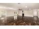 Living room featuring tile floors, recessed lights, and multiple entryways, offering a modern feel at 15202 N 71St Dr, Peoria, AZ 85381