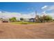 Large, well-maintained fenced yard with a mix of gravel and grass, offering ample space for various uses at 15202 N 71St Dr, Peoria, AZ 85381