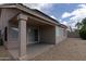 Relaxing covered patio and low-maintenance gravel backyard, perfect for outdoor living at 15351 W Port Royale Ln, Surprise, AZ 85379