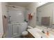 Bathroom with walk-in tub, updated fixtures, and a vanity at 15351 W Port Royale Ln, Surprise, AZ 85379