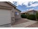 Charming single-story home with desert landscaping, stone accents, and a two-car garage at 15351 W Port Royale Ln, Surprise, AZ 85379
