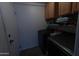 Well-equipped laundry room with modern appliances and storage cabinets at 15351 W Port Royale Ln, Surprise, AZ 85379