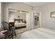 Comfortable bedroom with a ceiling fan, complemented by an interior mirrored closet and natural light at 15434 W Big Sky Dr, Surprise, AZ 85374