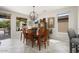 Bright dining area with natural light, neutral walls, and a stylish chandelier at 15434 W Big Sky Dr, Surprise, AZ 85374