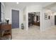 Open foyer featuring neutral colors and tiled floors that lead to various living spaces at 15434 W Big Sky Dr, Surprise, AZ 85374