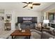 Comfortable living room with a decorative ceiling fan and ample seating at 15434 W Big Sky Dr, Surprise, AZ 85374
