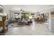 Open-concept living space with tiled floors, comfortable seating, and abundant natural light at 15434 W Big Sky Dr, Surprise, AZ 85374