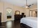 Spacious primary bedroom with wood floors, lots of natural light, and an ensuite bathroom at 16577 W Garfield St, Goodyear, AZ 85338