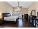 Spacious primary bedroom with wood floors, lots of natural light, and ceiling fan at 16577 W Garfield St, Goodyear, AZ 85338