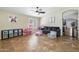 Bright, cozy living room with tile flooring and ample space for relaxation and play at 16577 W Garfield St, Goodyear, AZ 85338