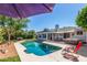 Backyard featuring a pool, hot tub, and patio area, perfect for outdoor entertaining at 1708 E Impala Ave, Mesa, AZ 85204