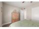 Bedroom featuring a wood dresser, neutral walls, and light-colored baseboards at 1708 E Impala Ave, Mesa, AZ 85204