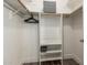 Organized walk-in closet with shelving, drawers, and hanging space at 1708 E Impala Ave, Mesa, AZ 85204