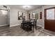 Cozy dining room with modern wood floors and plenty of natural light at 1708 E Impala Ave, Mesa, AZ 85204