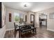 Bright dining area with modern wood floors and an open view to the kitchen at 1708 E Impala Ave, Mesa, AZ 85204