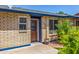 Charming home entrance featuring a decorative door and lush green landscaping at 1708 E Impala Ave, Mesa, AZ 85204
