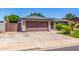 Beautifully maintained home with a spacious driveway and well-manicured landscaping at 1708 E Impala Ave, Mesa, AZ 85204