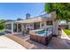 Outdoor hot tub and patio, perfect for relaxation and entertaining, with shade covering and decor at 1708 E Impala Ave, Mesa, AZ 85204