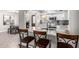 Modern kitchen with white cabinets, granite countertops, and stainless steel appliances at 1708 E Impala Ave, Mesa, AZ 85204