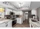 Well-lit kitchen with stainless steel appliances, tile backsplash, and granite countertops at 1708 E Impala Ave, Mesa, AZ 85204