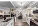 Open kitchen with stainless steel appliances, granite countertops, and wood-style flooring at 1708 E Impala Ave, Mesa, AZ 85204