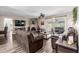 Spacious living room with a cozy fireplace, modern floors, and comfortable seating at 1708 E Impala Ave, Mesa, AZ 85204