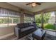 Comfortable living room with large windows and sliding glass doors at 1708 E Impala Ave, Mesa, AZ 85204