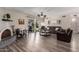 Inviting living room with stylish wood floors and a cozy fireplace at 1708 E Impala Ave, Mesa, AZ 85204