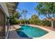 Refreshing backyard pool featuring a patio area and lush landscaping for a serene outdoor experience at 1708 E Impala Ave, Mesa, AZ 85204