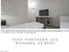 Bright bedroom with a flat screen tv, wardrobe and a neutral color palette at 17205 W Northern Ave, Waddell, AZ 85355