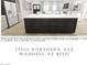 Modern kitchen with a large center island, stainless steel appliances, and a clean design at 17205 W Northern Ave, Waddell, AZ 85355